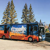Photo of a company tour bus that says 'National Awareness Tour' and 'Holodomor the Ukrainian Genocide'.